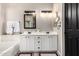 Bathroom featuring a double vanity with an undermount sink and decorative lighting at 29794 N Little Leaf Dr, San Tan Valley, AZ 85143