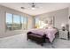 Bright bedroom with large windows, a ceiling fan, and stylish decor at 29794 N Little Leaf Dr, San Tan Valley, AZ 85143