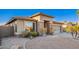 Inviting single-story home boasting desert landscaping, stone accents, and a convenient two-car garage at 29794 N Little Leaf Dr, San Tan Valley, AZ 85143