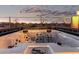 Relaxing hot tub with jets overlooking the neighborhood homes and a vibrant sunset sky at 29794 N Little Leaf Dr, San Tan Valley, AZ 85143