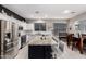 Spacious kitchen with stainless steel appliances, a large island, and an adjacent dining area at 29794 N Little Leaf Dr, San Tan Valley, AZ 85143