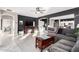 Open-concept living space with tile flooring, fireplace, and seamless flow into the kitchen at 29794 N Little Leaf Dr, San Tan Valley, AZ 85143