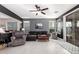 Inviting living room with tile flooring, plush seating, and abundant natural light at 29794 N Little Leaf Dr, San Tan Valley, AZ 85143