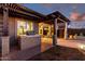 Stylish outdoor kitchen with grill and pergola, enhancing the backyard with entertainment possibilities and dining al fresco at 29794 N Little Leaf Dr, San Tan Valley, AZ 85143