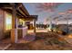 Outdoor kitchen with covered patio, a built-in grill, and a serene outdoor space with manicured lawn at 29794 N Little Leaf Dr, San Tan Valley, AZ 85143