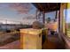 Well-equipped outdoor kitchen with a built-in grill, perfect for enjoying open-air dining and gatherings at 29794 N Little Leaf Dr, San Tan Valley, AZ 85143
