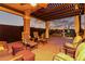 Relaxing covered patio with comfortable seating, string lights, and view of the backyard at 29794 N Little Leaf Dr, San Tan Valley, AZ 85143