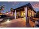 Charming covered patio with outdoor seating, ideal for relaxation and enjoying the beautiful landscape at 29794 N Little Leaf Dr, San Tan Valley, AZ 85143