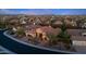 Aerial view of a desert community featuring homes with tile roofs in a mountain setting at 30311 N 52Nd Pl, Cave Creek, AZ 85331