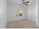 Bright bedroom with ceiling fan, neutral carpet, and closet at 30311 N 52Nd Pl, Cave Creek, AZ 85331