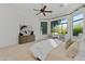 This bedroom features a bay window and sitting area, carpet, and a ceiling fan at 30311 N 52Nd Pl, Cave Creek, AZ 85331