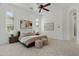 Spacious bedroom featuring plush carpet, ceiling fan, neutral walls, and stylish decor at 30311 N 52Nd Pl, Cave Creek, AZ 85331