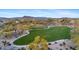 Community park with winding sidewalk, green space, and covered ramada at 30311 N 52Nd Pl, Cave Creek, AZ 85331