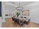 Bright dining area with stylish chandelier, table setting, and a view into the living room at 30311 N 52Nd Pl, Cave Creek, AZ 85331