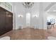 Grand foyer with soaring ceilings, elegant chandelier, and travertine flooring at 30311 N 52Nd Pl, Cave Creek, AZ 85331
