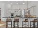 Kitchen featuring a breakfast bar with pendant lighting, modern appliances, and ample countertop space for cooking at 30311 N 52Nd Pl, Cave Creek, AZ 85331