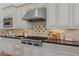 Modern kitchen showcasing stainless steel appliances, custom cabinetry, and stylish backsplash for a contemporary aesthetic at 30311 N 52Nd Pl, Cave Creek, AZ 85331