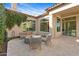 Charming outdoor patio area with a cozy fire pit, comfortable seating, and stylish string lights at 30311 N 52Nd Pl, Cave Creek, AZ 85331