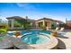 Resort-style backyard pool with spa, patio, and lounge chairs for relaxing and entertaining outdoors at 30311 N 52Nd Pl, Cave Creek, AZ 85331