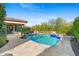 Gorgeous backyard pool area with integrated spa and spacious patio surrounded by lush landscaping at 30311 N 52Nd Pl, Cave Creek, AZ 85331