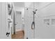 Modern shower with glass enclosure and white tiled walls at 30311 N 52Nd Pl, Cave Creek, AZ 85331