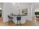 Contemporary wet bar features black countertops, bar seating, and stylish lighting at 30311 N 52Nd Pl, Cave Creek, AZ 85331