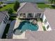 Aerial view showcasing the backyard pool, covered patio with hanging chairs and desert landscaping at 3173 E Page Ave, Gilbert, AZ 85234