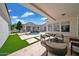 Inviting backyard with a pool, patio seating, and lush landscaping at 3173 E Page Ave, Gilbert, AZ 85234