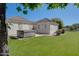 Expansive backyard with a hot tub, green lawn, and well-maintained landscaping at 3173 E Page Ave, Gilbert, AZ 85234