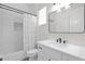 Clean bathroom with white tile, black fixtures, and a shower-tub combination with a curtain at 3173 E Page Ave, Gilbert, AZ 85234