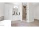 Modern bathroom featuring a glass shower, elegant vanity, and neutral tile flooring at 3173 E Page Ave, Gilbert, AZ 85234