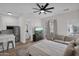 Spacious bedroom with a kitchenette, seating area, and access to the outdoors at 3173 E Page Ave, Gilbert, AZ 85234