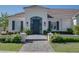 Inviting front entrance with brick walkway, arched entry, and decorative landscaping at 3173 E Page Ave, Gilbert, AZ 85234