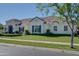 Beautiful single-story home with lush green lawn, tile roof, and elegant landscaping at 3173 E Page Ave, Gilbert, AZ 85234
