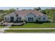 Charming single-story home with lush green lawn, neutral paint, and a tile roof at 3173 E Page Ave, Gilbert, AZ 85234