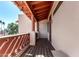 Cozy balcony with wooden floors and a decorative railing, providing a charming outdoor space at 333 N Pennington Dr # 15, Chandler, AZ 85224