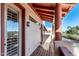 Scenic balcony featuring wooden floors, decorative railing, and a sunny outdoor space at 333 N Pennington Dr # 15, Chandler, AZ 85224