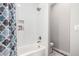 Bright bathroom featuring a shower and tub combination with sleek white subway tile and modern fixtures at 333 N Pennington Dr # 15, Chandler, AZ 85224
