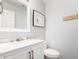 Bright half bath with white vanity, modern fixtures, and charming wall decor at 333 N Pennington Dr # 15, Chandler, AZ 85224