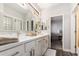 Light-filled bathroom with double vanity, stylish mirrors, and modern fixtures at 333 N Pennington Dr # 15, Chandler, AZ 85224