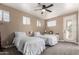 Cozy bedroom with two twin beds, ceiling fan, and plenty of natural light at 333 N Pennington Dr # 15, Chandler, AZ 85224