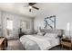 Comfortable bedroom with neutral tones, ceiling fan, and access to outdoor patio at 333 N Pennington Dr # 15, Chandler, AZ 85224