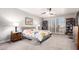Spacious bedroom with large windows, neutral carpet, and gray upholstered bed frame at 333 N Pennington Dr # 15, Chandler, AZ 85224