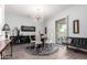 Modern dining room with stylish light fixture, sleek furniture, and sliding glass doors bringing the outside in at 333 N Pennington Dr # 15, Chandler, AZ 85224