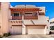 Southwestern-style home featuring a balcony with decorative railing and two-car garage, providing a blend of charm and convenience at 333 N Pennington Dr # 15, Chandler, AZ 85224