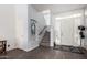 Bright foyer with staircase, tiled floors, and arched doorway offers a warm welcome with ample natural light at 333 N Pennington Dr # 15, Chandler, AZ 85224