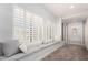 Cozy hallway featuring a cushioned window seat with storage below and neutral decor at 333 N Pennington Dr # 15, Chandler, AZ 85224