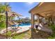 Lush backyard with swimming pool, rock waterfall, and ample patio space at 3353 E Nolan Dr, Chandler, AZ 85249