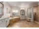 Bathroom featuring double sinks, a bathtub with tile surround, and a shower at 3353 E Nolan Dr, Chandler, AZ 85249