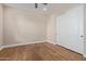 Bedroom featuring wood floors and a closet with sliding doors at 3353 E Nolan Dr, Chandler, AZ 85249